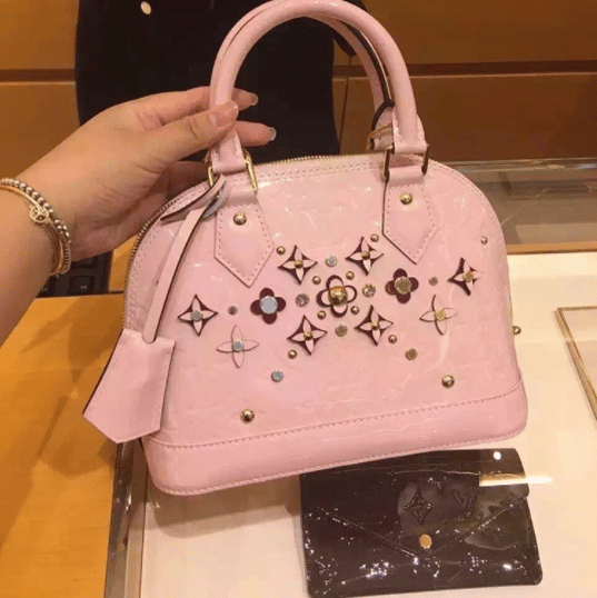 Louis Vuitton Alma Vernis Bag Reference Guide - Spotted Fashion