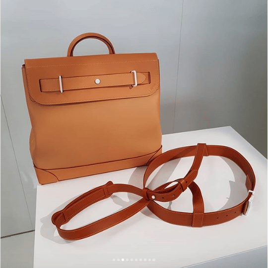 Louis Vuitton Menswear Ready to Wear Spring Summer Close up of brown  patterned bag white LV initials, white leather trim and Stock Photo - Alamy