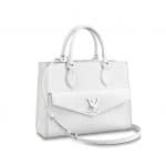 The Miller Affect wearing a taupe LockMe bag from Louis Vuitton